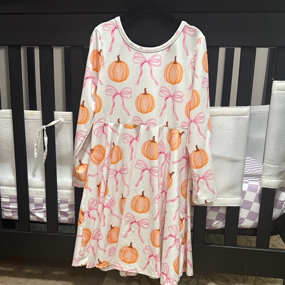 Rylee Faith designs girls pumpkin and bow dress